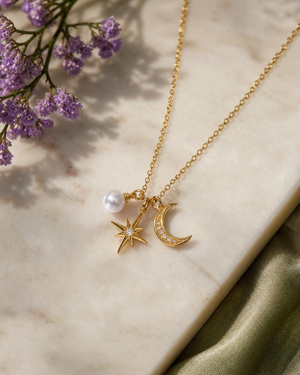 A gold-plated charm necklace from the Goldie Luxe collection